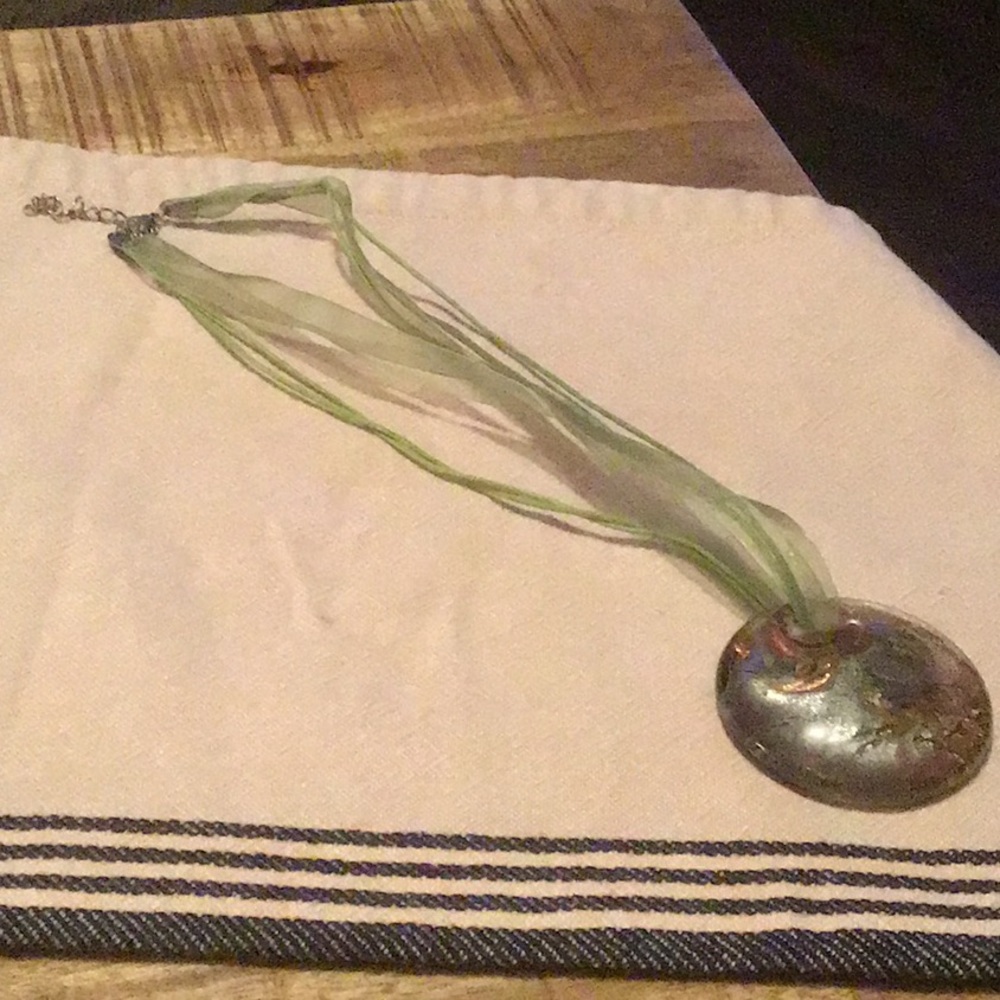 Glass pendant necklace on material chain